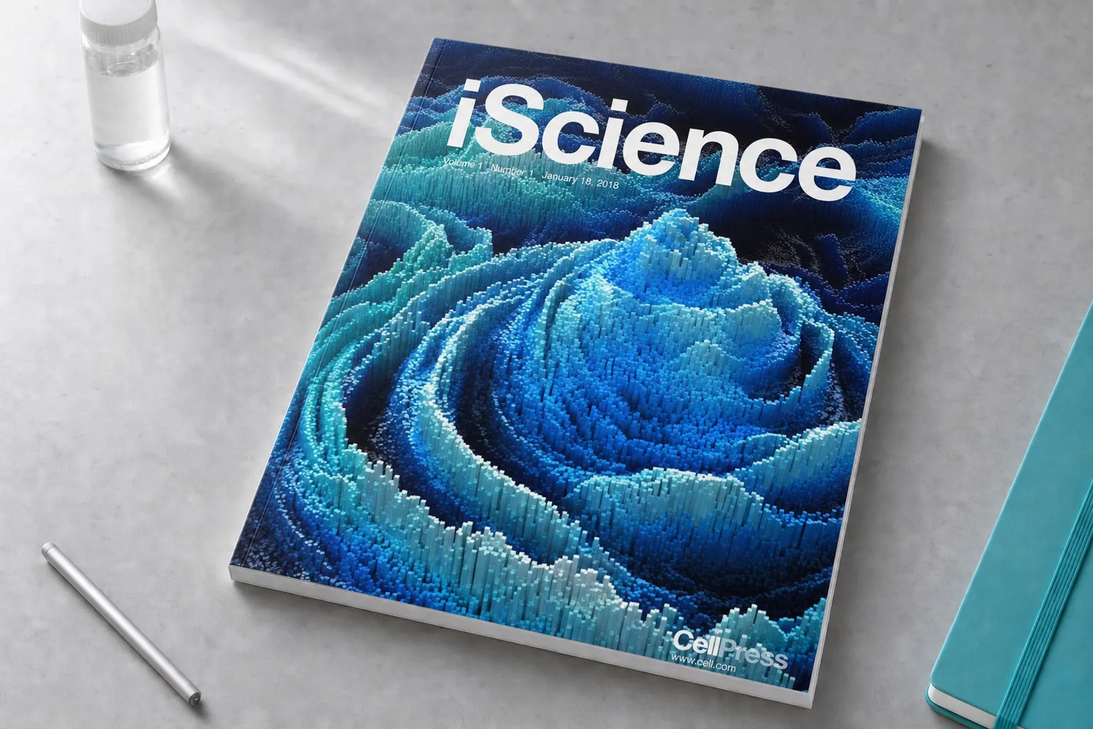 iScience journal resting on a bright research studio desk